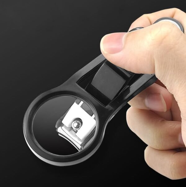 Nail clipper with magnifying glass