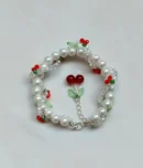 Cherry pearl bracelet size reference shown on hand