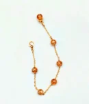 Cracked golden beads bracelet with gold chain by Stay Decorative