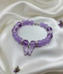 Purple gemstone butterfly bracelet worn on wrist showing adjustable fit