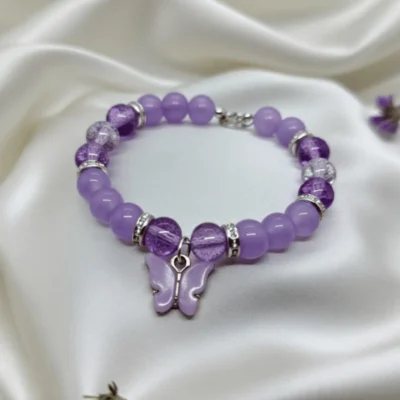 Purple gemstone butterfly bracelet worn on wrist showing adjustable fit
