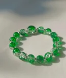Close-up of handmade green crackle glass beaded bracelet by Stay Decorative